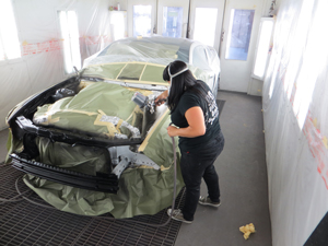 Woman painting Mustang